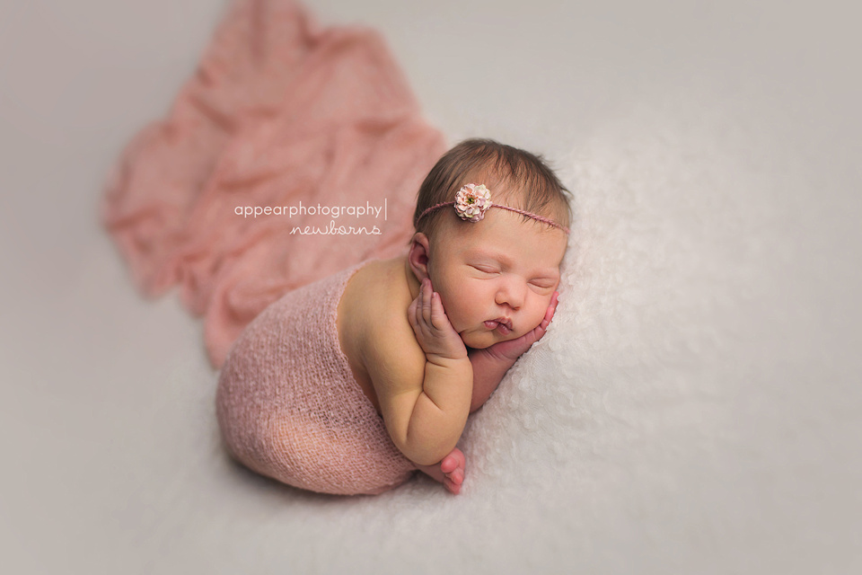 Appear Photography, Hoover, Birmingham, AL newborn baby photographer, taco pose, hands on face, pink wrap