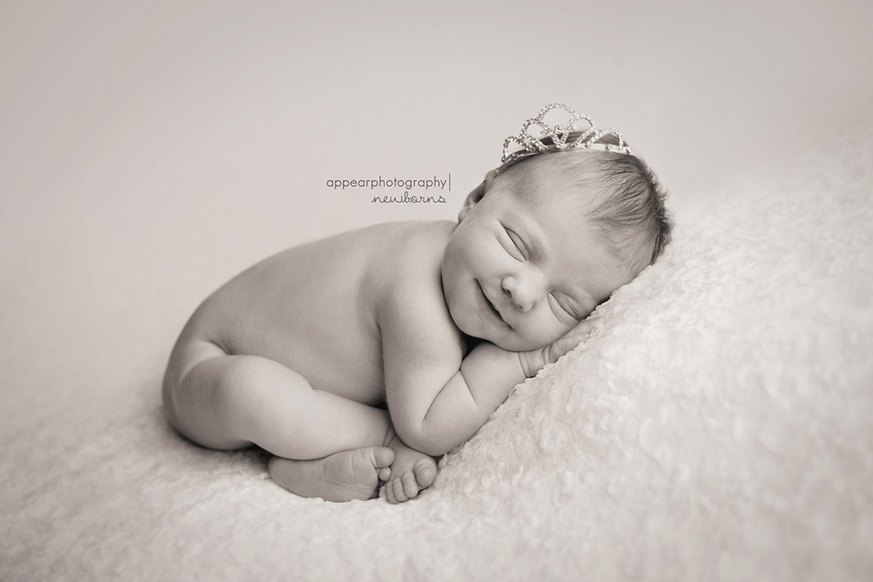 Appear Photography, Hoover, Birmingham, AL newborn baby photographer, newborn with tiara crown, smiling, black and white, taco pose