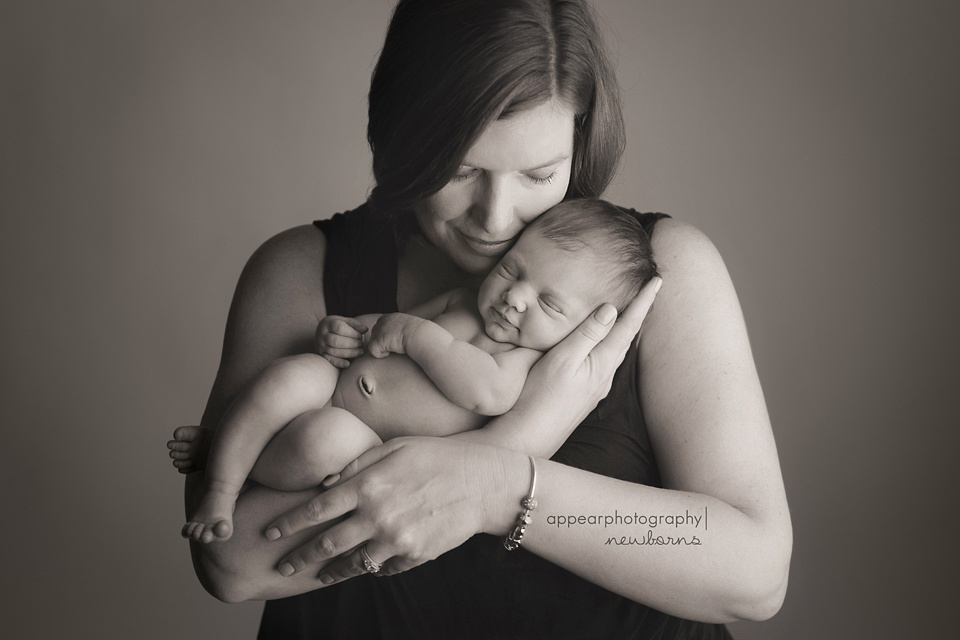 Appear Photography, Hoover, Birmingham, AL newborn baby photographer, mother and newborn baby, smiling, black and white, soft lighting