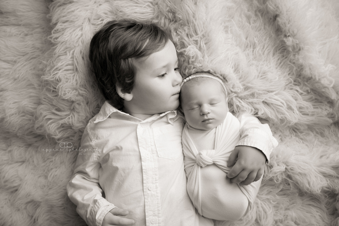 appear photography, hoover, birmingham, al newborn baby photographer, photography, brother sister, siblings, float, swaddle, black and white, kiss, toddler